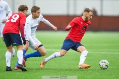 20240127 ÖIS Amel Mujanic och IK Oddevolds Axel Pettersson under träningsmatchen ÖIS och IK Oddevold på Valhalla IP den 27 januari 2024 i Göteborg.